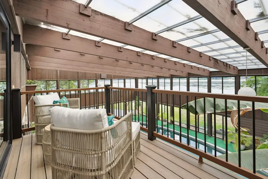Lounge chairs on the balcony above the indoor pool