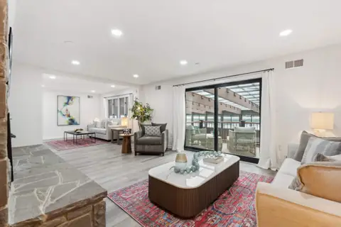 The upstairs living room with doors to the pool balcony