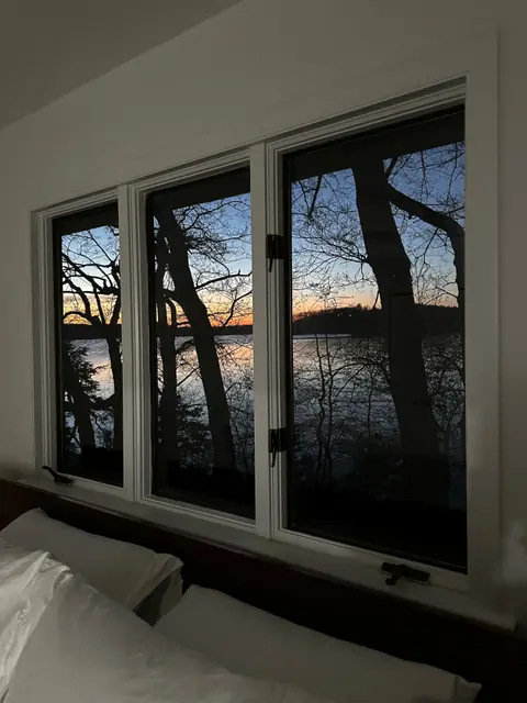 The view from a bedroom window at sunset